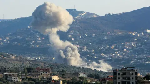 RABIH DAHER / Getty Images Smoke rises from Kfar Kila, a village in southern Lebanon