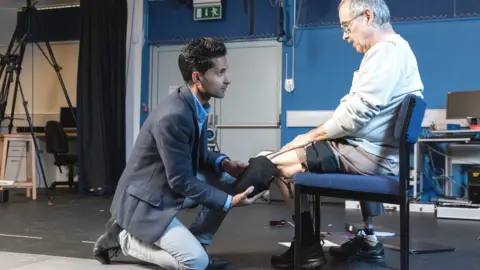 Tim Gander/Bath Uni Dr Dhokia fitting the liner