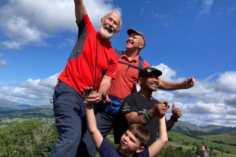 Mountaineer Sir Chris Bonington, left, at the summit of Orrest Head in the Lake District with Hari Budha Magar, right, Steve Watts, centre, and Tony Hudgell, front