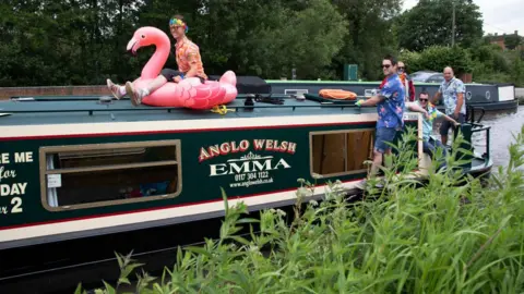 Getty Images Friends on a narrow boat in Worcestershire