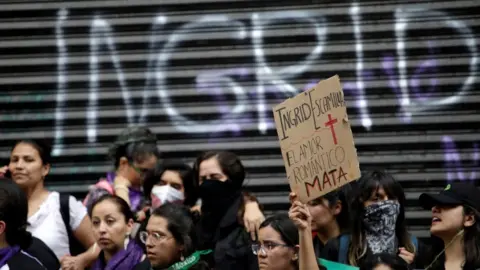 Reuters A demonstrator holds up a placard