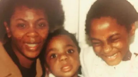 @YRSADALEYWARD Yrsa Daley-Ward (right) with her brother (centre) and her mother (left)