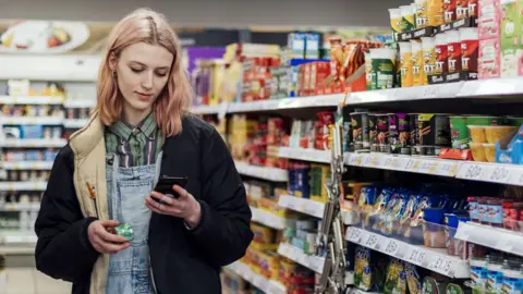 Getty Images A woman in a supermarket