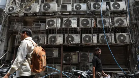 EPA Multiple air conditioning units outside New Delhi office