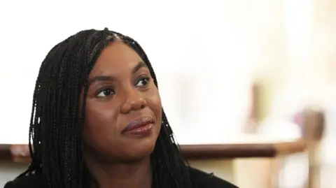 PA Media Conservative Party leader Kemi Badenoch looks into the distance