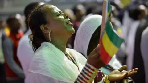 Getty Images Tens of thousands of Ethiopian Orthodox believers gather at Millennium Hall in Addis Ababa - 4 August 2018