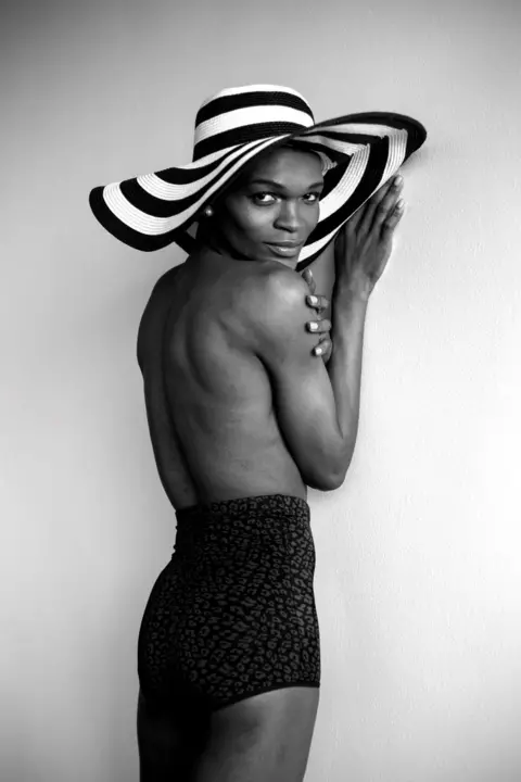 Zanele Muholi Person wearing black and white hat