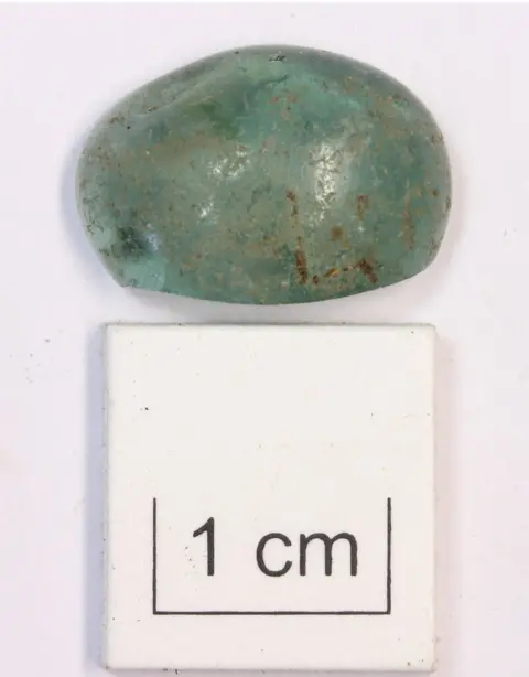 AOC Archaeology Ltd Roman glass made into a gaming piece