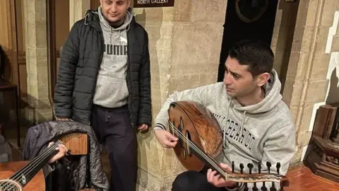 Sam Slatcher Man playing oud