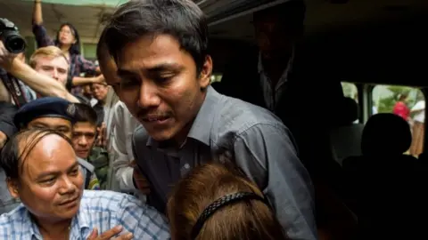 AFP Detained Reuters journalist Kyaw Soe Oo outside court in Yangon, 27 December 2017