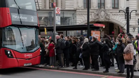 Getty Images A bus stop queue outside Victoria Station