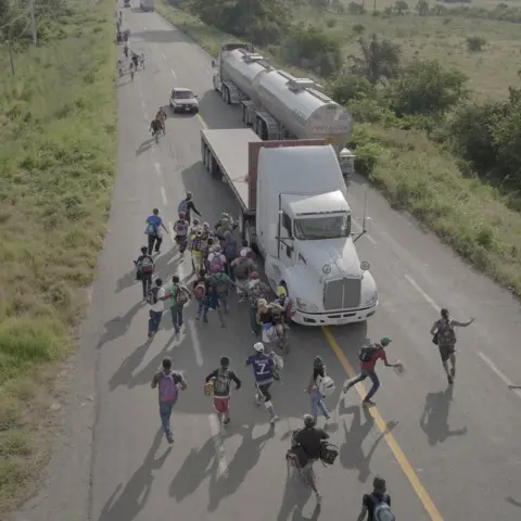 Pieter Ten Hoopen, Agence Vu/Civilian Act People are seen on a road