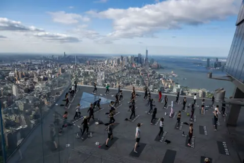 Alexi Rosenfeld/Getty Images Yoga above New York