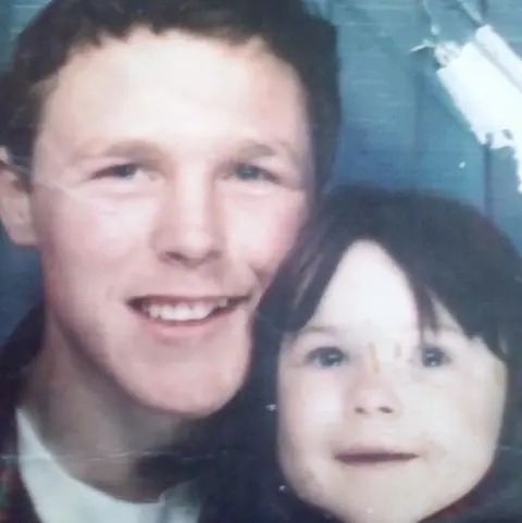 Family photo Sarah-Jane Young as a child alongside her father, L/Cpl Jeffrey Young