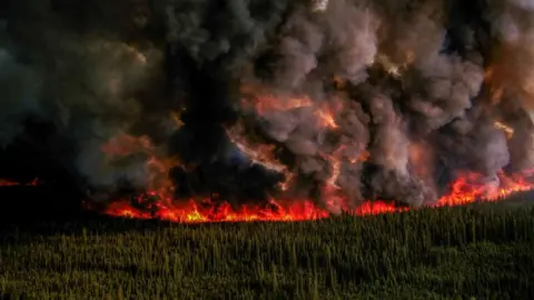 Reuters Smoke rises from a wildfire in British Columbia, Canada,