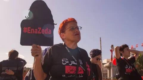 Ibrahim Guedich Women wearing "MeToo" T-shirts protesting about masturbation photos