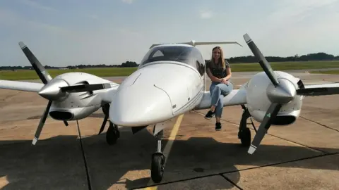 Bethan Haley Bethan Haley sits on the wing of her Diamond DA42 aircraft in Sweden