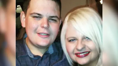 Laura McDermott Joseph McDermott, a young man with short, dark hair, posing for a photo with his sister Laura, who has blue eyes and straight blonde hair, styled in a bob. Joe is wearing a blue denim shirt, open at the collar. Laura is smiling and wearing red lipstick.
