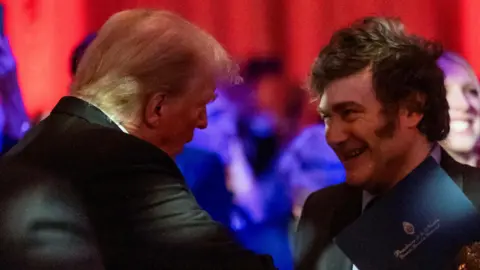 Reuters US President-elect Donald Trump shakes hands with Argentine President Javier Milei at the America First Policy Institute gala at Mar-A-Lago in Palm Beach, Florida, 14 November 2024