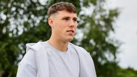 Josh Mulligan arrives ahead of pre-season training at the Hibernian Training Centre, on June 27, in Edinburgh, Scotland.