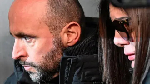 EPA/Shutterstock Jacques and Jessica Moretti, French owners of Le Constellation bar in Crans-Montana, arrive for questioning by Swiss prosecutors in Sion. Photo: 9 January 2026