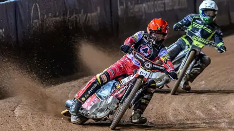 Dan Bewley of Belle Vue Aces in red leads Jason Doyle of Ipswich Witches in white during their 2025 Rowe Motor Oil Premiership Play Off Semi Final