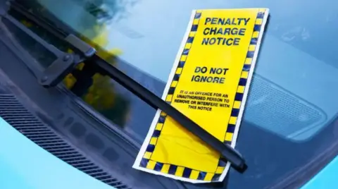 A yellow parking fine slipped under the windscreen wiper of a car.