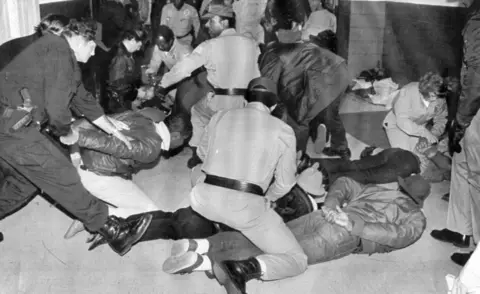 Getty Images US Marshals arrest fugitives as part of Operation Flagship. The fugitives came to the DC Convention Center to pick up counterfeit Redskin tickets that were being touted as advertising for Flagship Television.