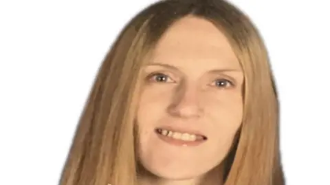 West Yorkshire Police A middle-aged blonde woman with blue eyes, pictured against a blank white backdrop.