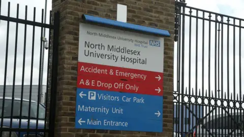 Getty Images A sign seen outside the North Middlesex University Hospital in Edmonton, north London.