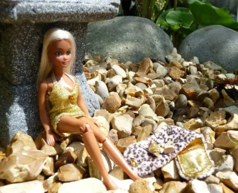 Heather Swann Pippa doll posing in sparkly gold outfit