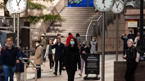 Getty Images Commuters at Canary Wharf