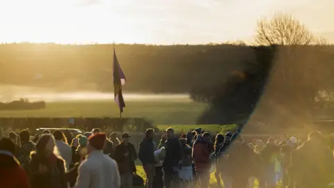 Reuters Revellers celebrate sunrise at Newgrange Neolithic monument.