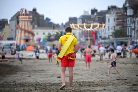 Finnbarr Webster/Getty Images Lifeguard on Weymouth beach