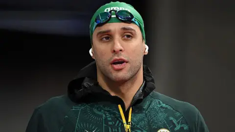 South Africa's Chad le Clos arrives for the Men's 50m Butterfly Semi-Final at the swimming event at the Tollcross International Swimming Centre in Glasgow, on day five of the Commonwealth Games 