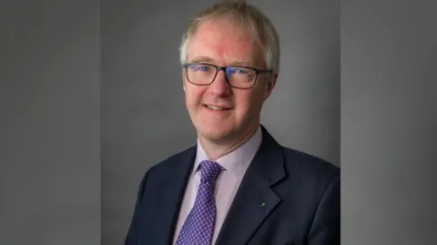 Cheshire East Council Cheshire East Council leader Sam Corcoran