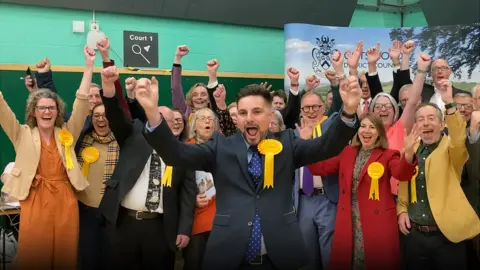 BBC Cotswold District Council leader Joe Harris leads the Liberal Democrat celebrations