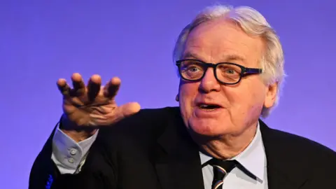 Getty Images Michael Grade speaking at a conference in 2024