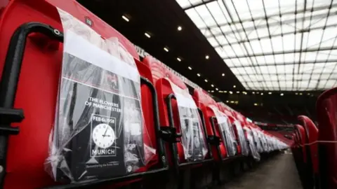 Getty Images Fans received a pack containing a book about the tragedy