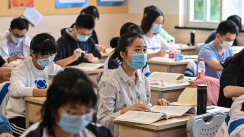 AFP Students pictured in a classroom wearing masks in Shanghai in 2020