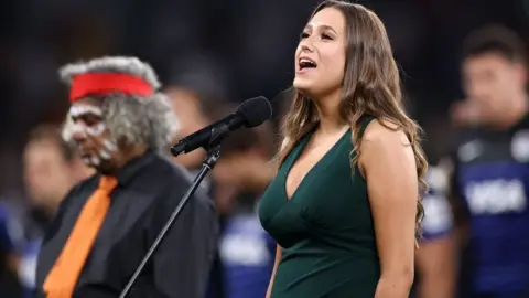 Getty Images Wiradjuri woman Olivia Fox sang the national anthem in indigenous language Dharug in December