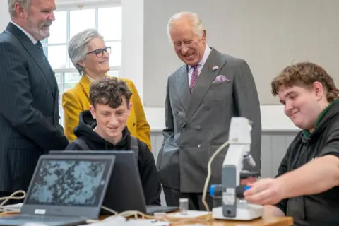 Getty Images King Charles meets students carrying out root and soil structure analysis during a visit to officially open the MacRobert Farming and Rural Skills Centre at Dumfries House in September 2023 