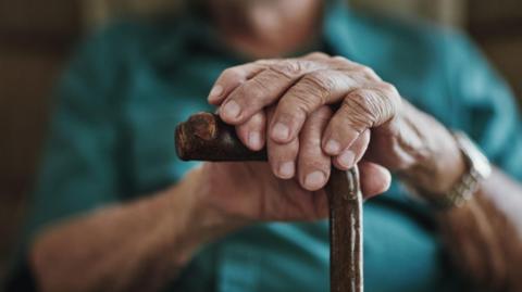 A posed stock image of an elderly man