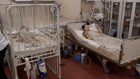 BBC Two children rest in a Ukrainian hospital