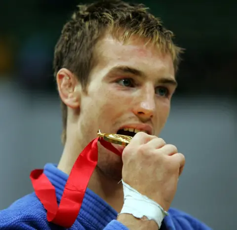 Getty Images Craig Fallon wins a gold medal