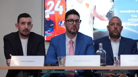 PA Media Lee Coates, James Coates and Darren Coates at a press conference