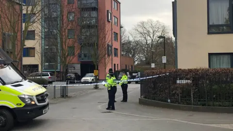 PA Police activity outside a block of flats on Union Lane, Isleworth