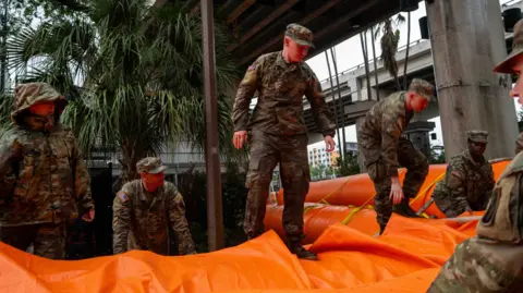 Army mounting  up   flood defences