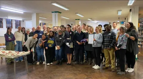 Sunday Centre Volunteers from Sheffield's Sunday Centre, which has been cooking hot meals for people in need every Sunday, awarded the Kings Award for Voluntary Service by Dame Hilary Chapman, Lord Lieutenant of South Yorkshire (front).