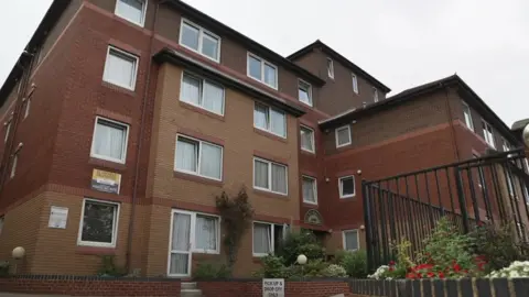 An external view of the four-storey apartment building.